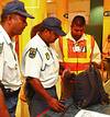 Security personnel check through baggage